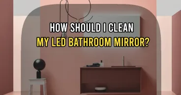 How should I clean my LED bathroom mirror?